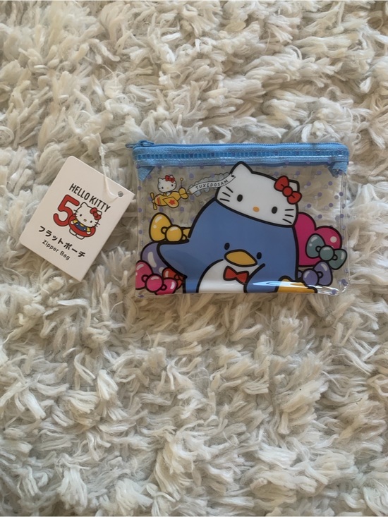 Sanrio Handbags - Sanrio Hello Kitty 50th Anniversary Tuxedosam Flat Zip Mini Vinyl Pouch (NWT)